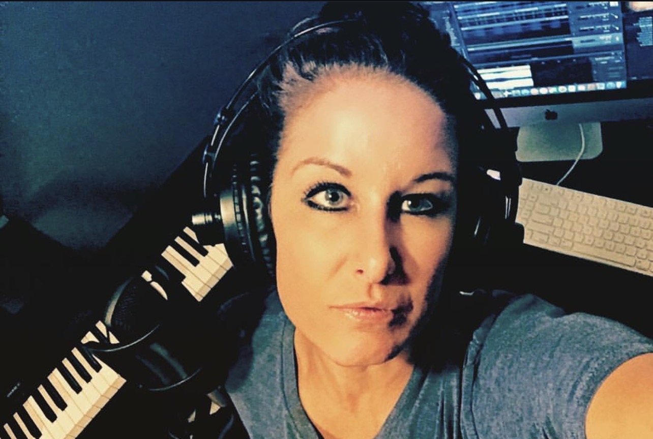 Courtney — founder of AUDIVUE — in her studio
